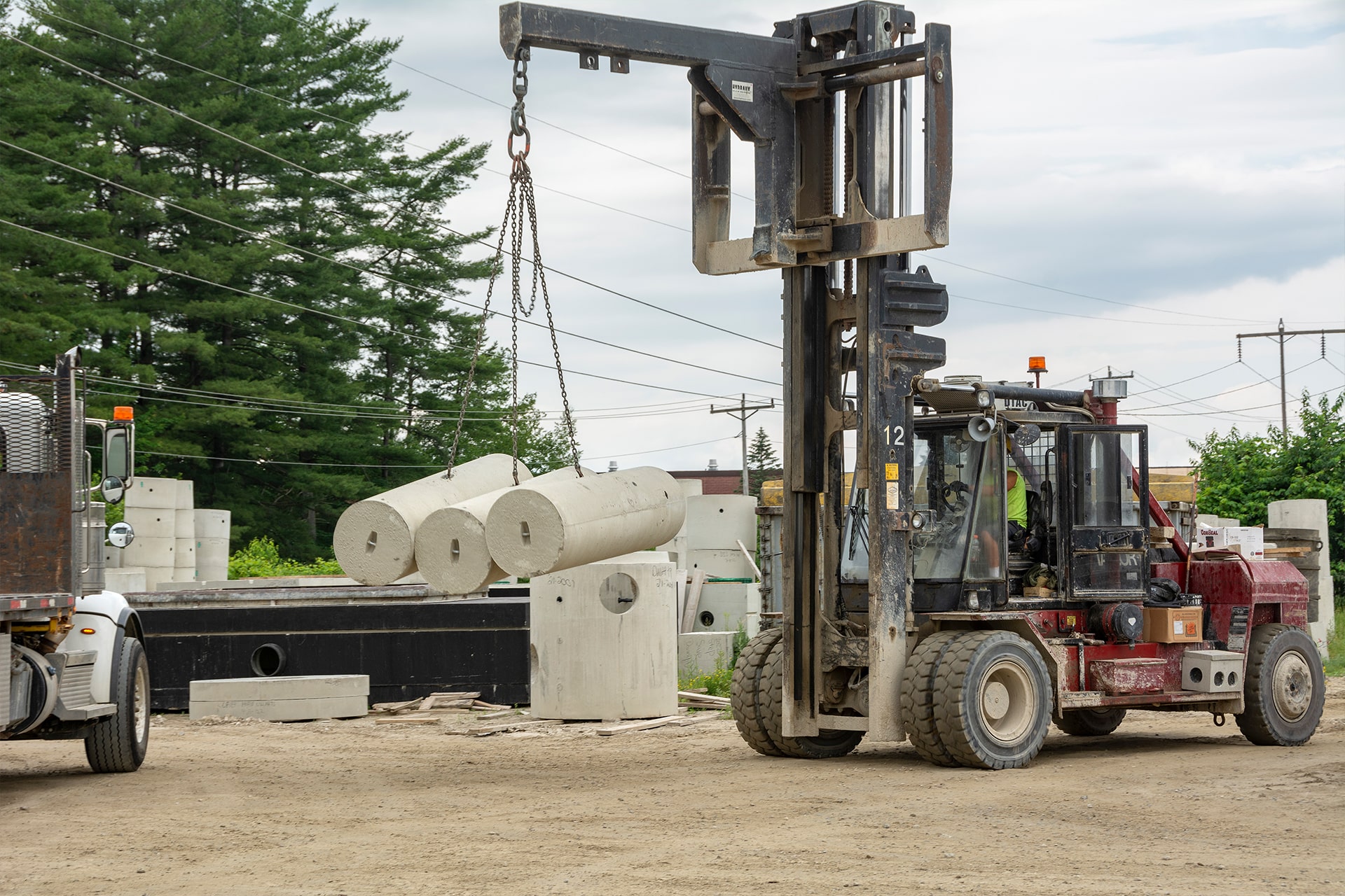 employee transporting precast products